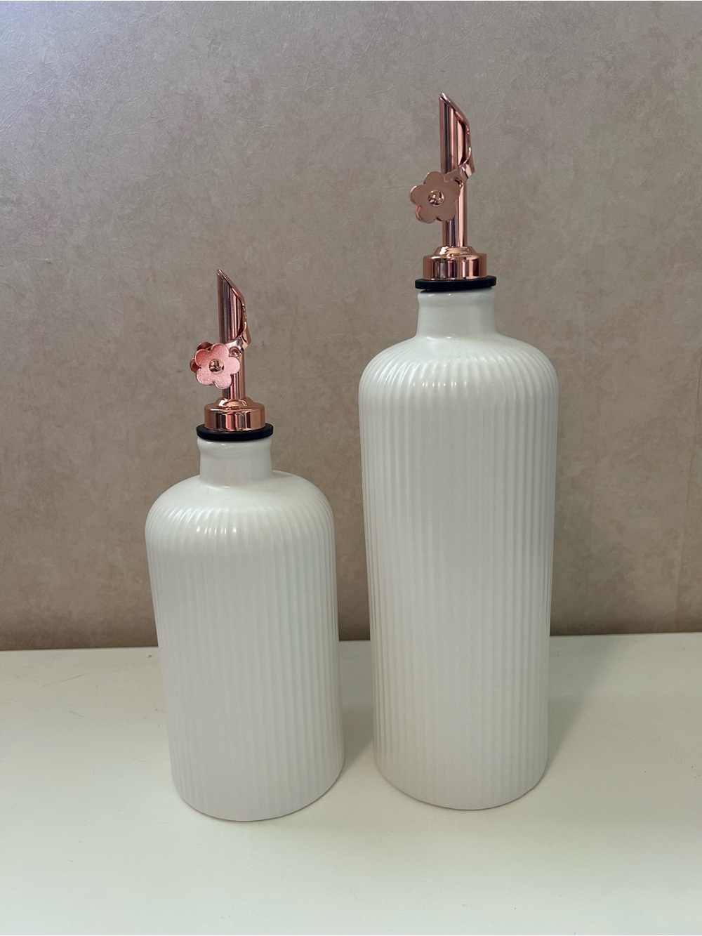 White Ribbed Ceramic Oil Dispenser with Rose Gold Pour Spout